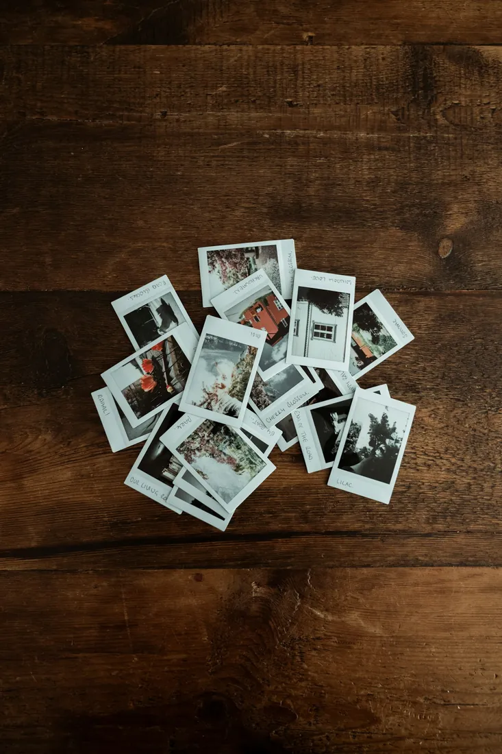 A pile of freshly printed Polaroid photos